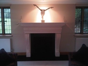 Large limestone fireplace installation in Surrey final