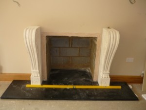 Mantel being assembled for large fireplace installation in Surrey