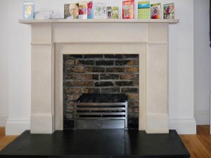 Limestone fireplace with Amhurst fire basket from Chesney's