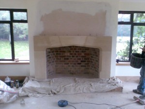 Large Tudor Limestone Fireplace installation in Guildford