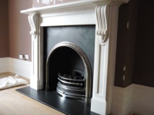 Maida vale fireplace installation. The Buckingham fireplace with ornate arch insert.