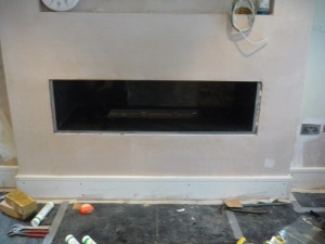 Black Granite Hole in the Wall Fireplace