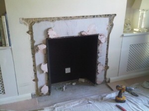 Removal of old fireplace before modena limestone fireplace 