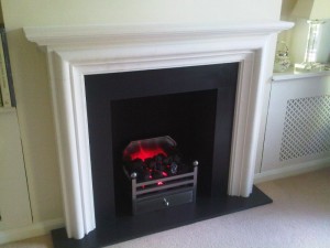 modena limestone fireplace with Elan basket and electric fire