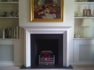 modena limestone fireplace with Elan basket and electric fire