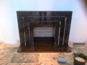 Stunning Granite Fireplace: Landing fireplace nearing completion