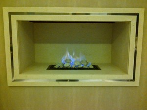 Limestone hole in wall fireplace with F500 gas fire from Nu Flame