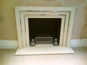 Limestone stepped fireplace: Living Room fireplace