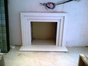 Limestone stepped fireplace: Living Room fireplace nearing completion