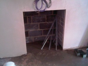 Limestone stepped fireplace: Living Room - original opening