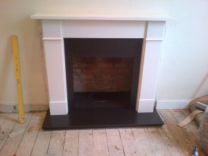 Flat Victorian limestone fireplace installation