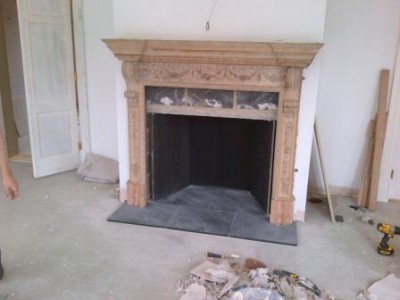 Installing antique wooden mantel into Drawing Room
