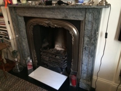 Marble fireplace before removal in Pimlico