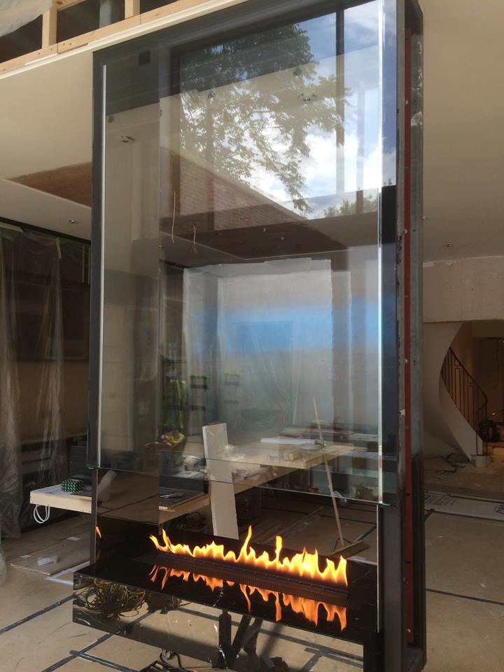 Hanging bespoke fireplace with burner and glass