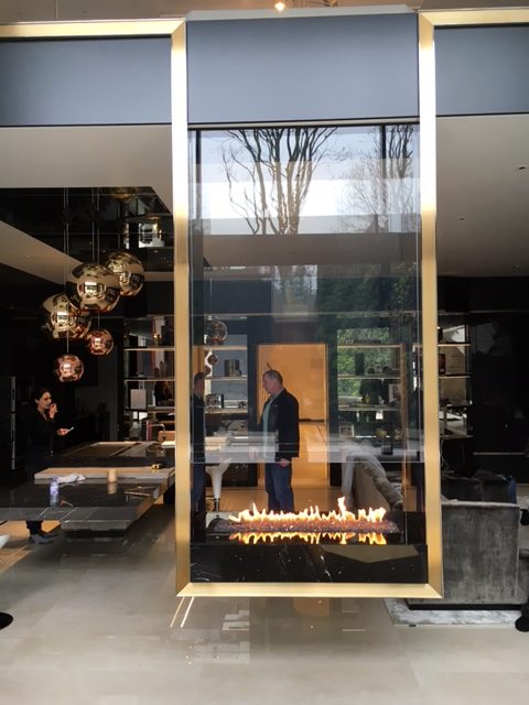 Hanging bespoke fireplace with double sided glass and gas burner
