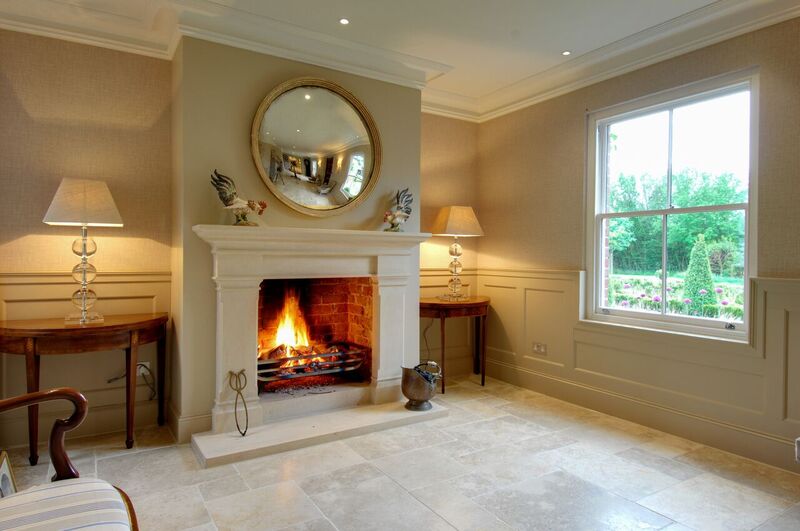 Beautiful bathstone hallway traditional fireplace installation in Winchester